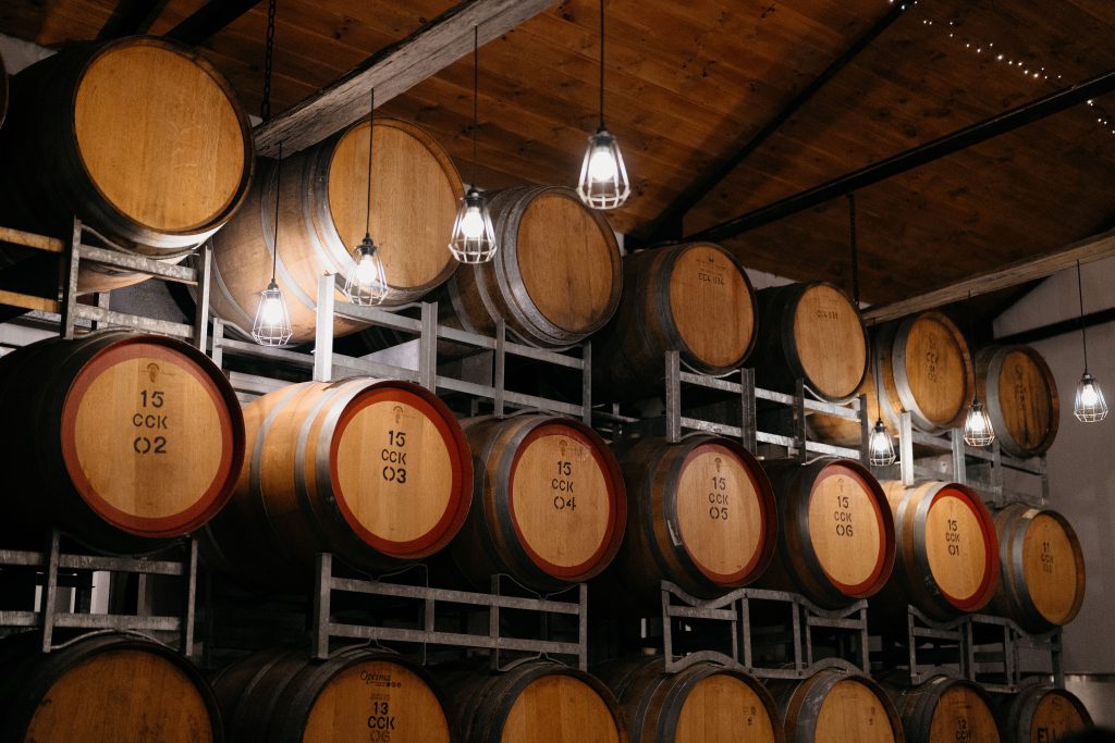 Rows of oak wine barrels in the Stonehurst cellar
